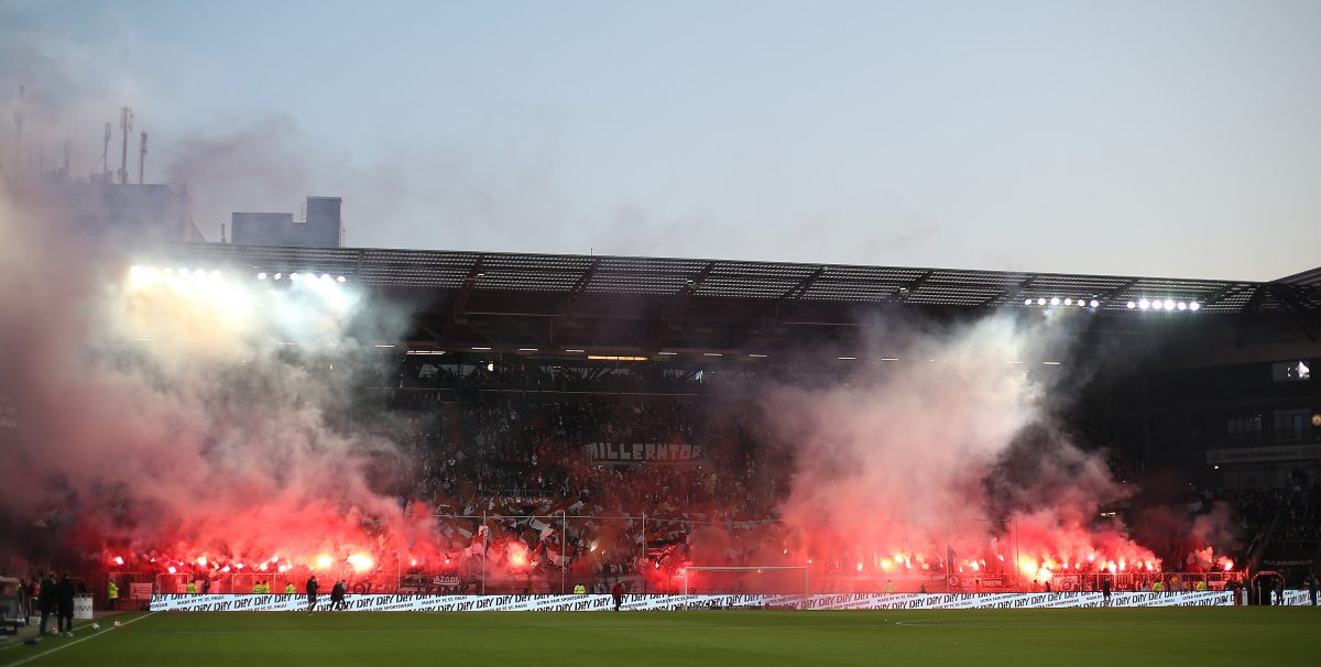 HAMBURG, GERMANY - APRIL 23: Supporters of FC St. Pauli burn pyro prior to the Second Bundesliga match between FC St. Pauli and SV Darmstadt 98 at Millerntor Stadium on April 23, 2022 in Hamburg, Germany.