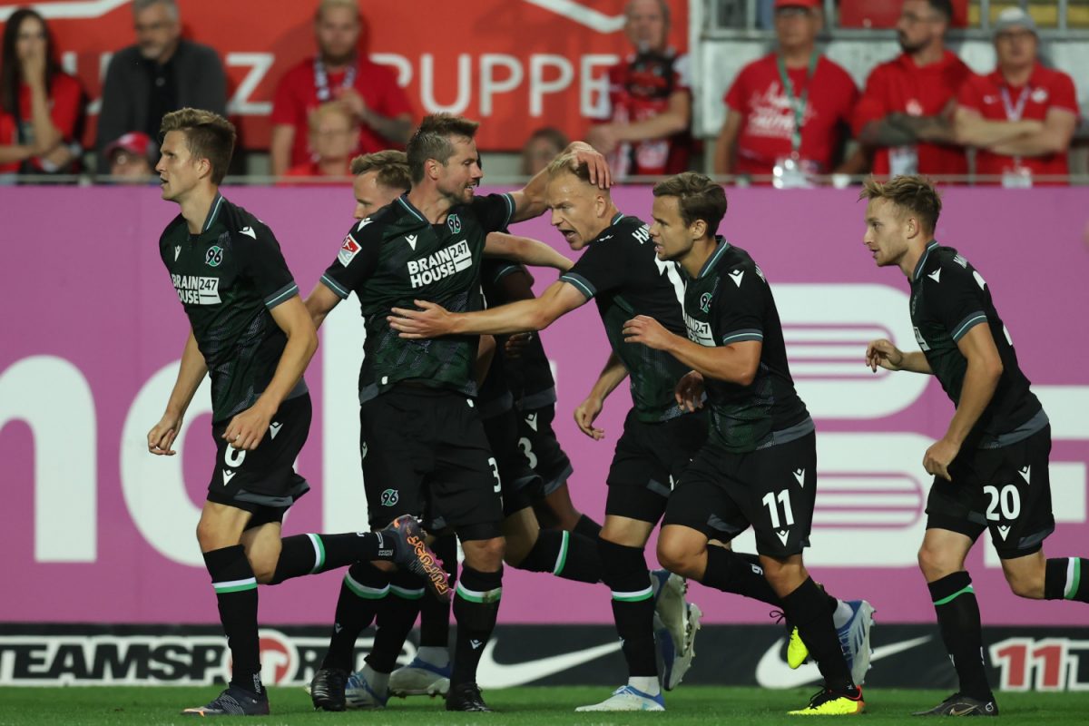 KAISERSLAUTERN, GERMANY - JULY 15: Havard Nielsen of Hannover celebrates their team's first goal with teammates during the Second Bundesliga match between 1. FC Kaiserslautern and Hannover 96 at Fritz-Walter-Stadion on July 15, 2022 in Kaiserslautern, Germany.