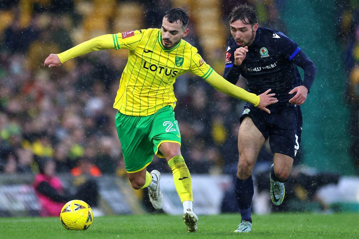 NORWICH, ENGLAND - JANUARY 08: Danel Sinani of Norwich City and Harry Pickering of Blackburn Rovers compete for the ball during the Emirates FA Cup Third Round match between Norwich City and Blackburn Rovers at Carrow Road on January 08, 2023 in Norwich, England. (Photo by Stephen Pond/Getty Images)