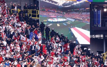 German anti-riot police officers stand in the grandstands next to supporters ahead of the UEFA Euro 2024 Group F football match between Turkey and Georgia at the BVB Stadion in Dortmund on June 18, 2024. (Photo by KENZO TRIBOUILLARD / AFP) (Photo by KENZO TRIBOUILLARD/AFP via Getty Images)