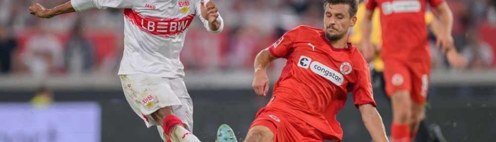 STUTTGART, GERMANY - SEPTEMBER 19: Tiago Tomas of VfB Stuttgart challenges Adam Dzwigala of FC St. Pauli during the Bundesliga match between VfB Stuttgart and FC St. Pauli at MHPArena on September 19, 2025 in Stuttgart, Germany. (Photo by Christian Kaspar-Bartke/Getty Images)