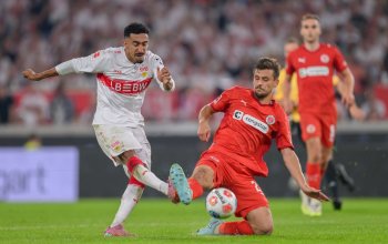 STUTTGART, GERMANY - SEPTEMBER 19: Tiago Tomas of VfB Stuttgart challenges Adam Dzwigala of FC St. Pauli during the Bundesliga match between VfB Stuttgart and FC St. Pauli at MHPArena on September 19, 2025 in Stuttgart, Germany. (Photo by Christian Kaspar-Bartke/Getty Images)