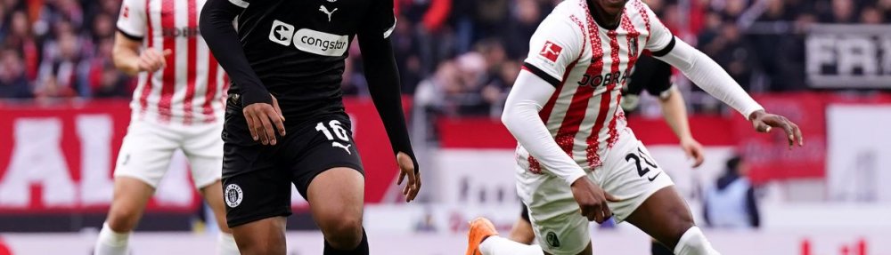 FREIBURG IM BREISGAU, GERMANY - NOVEMBER 09: Joel Chima Fujita of St Pauli is challenged by Junior Adamu of SC Freiburg during the Bundesliga match between SC Freiburg and FC St. Pauli at Europa-Park Stadion on November 09, 2025 in Freiburg im Breisgau, Germany. (Photo by Daniela Porcelli / Getty Images)