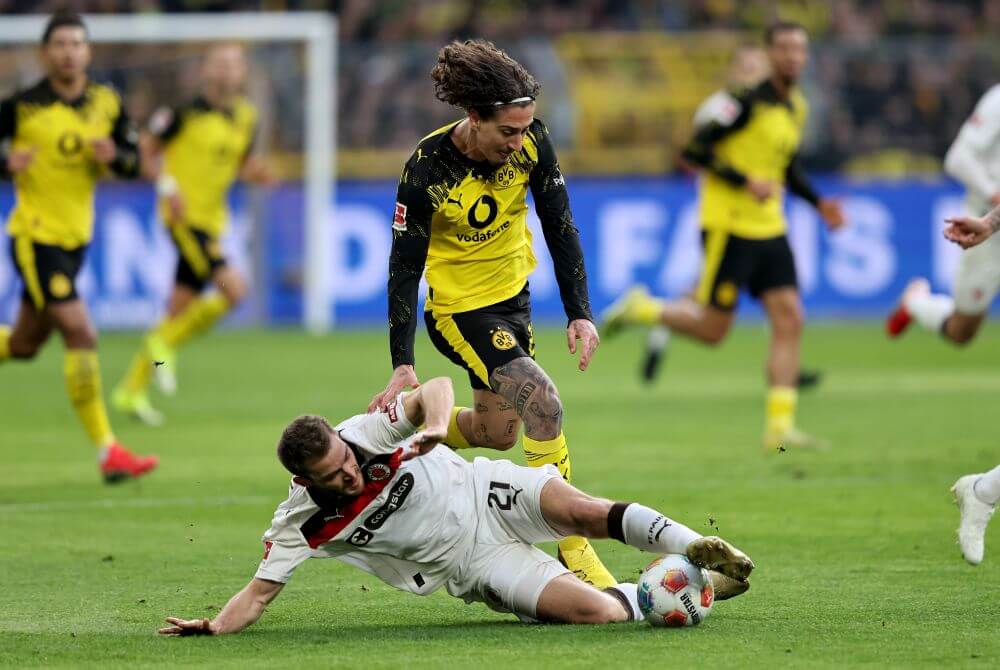 DORTMUND, GERMANY - JANUARY 17: Lars Ritzka of FC St. Pauli challenges Fabio Silva of Borussia Dortmund during the Bundesliga match between Borussia Dortmund and FC St. Pauli at Signal Iduna Park on January 17, 2026 in Dortmund, Germany. (Photo by Christof Koepsel/Getty Images)