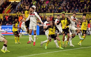 DORTMUND, GERMANY - JANUARY 17: Nico Schlotterbeck of Borussia Dortmund creates a headed chance under pressure from James Sands of FC St. Pauli during the Bundesliga match between Borussia Dortmund and FC St. Pauli at Signal Iduna Park on January 17, 2026 in Dortmund, Germany. (Photo by Christof Koepsel/Getty Images)