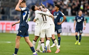 SINSHEIM, GERMANY - FEBRUARY 28: Joel Chima Fujita, Jackson Irvine and Arkadiusz Pyrka all of FC St. Pauli celebrate at the final whistle during the Bundesliga match between TSG Hoffenheim and FC St. Pauli at PreZero-Arena on February 28, 2026 in Sinsheim, Germany. (Photo by Sebastian Widmann/Getty Images)