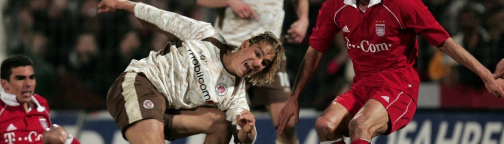 HAMBURG, GERMANY - APRIL 12: Felix Luz (L) of St.Pauli shoots at goal during the DFB German Cup Semi Final match between FC St. Pauli and Bayern Munich at the Millerntor Stadium on April 12, 2006 in Hamburg, Germany. (Photo by Martin Rose/Bongarts/Getty Images)
