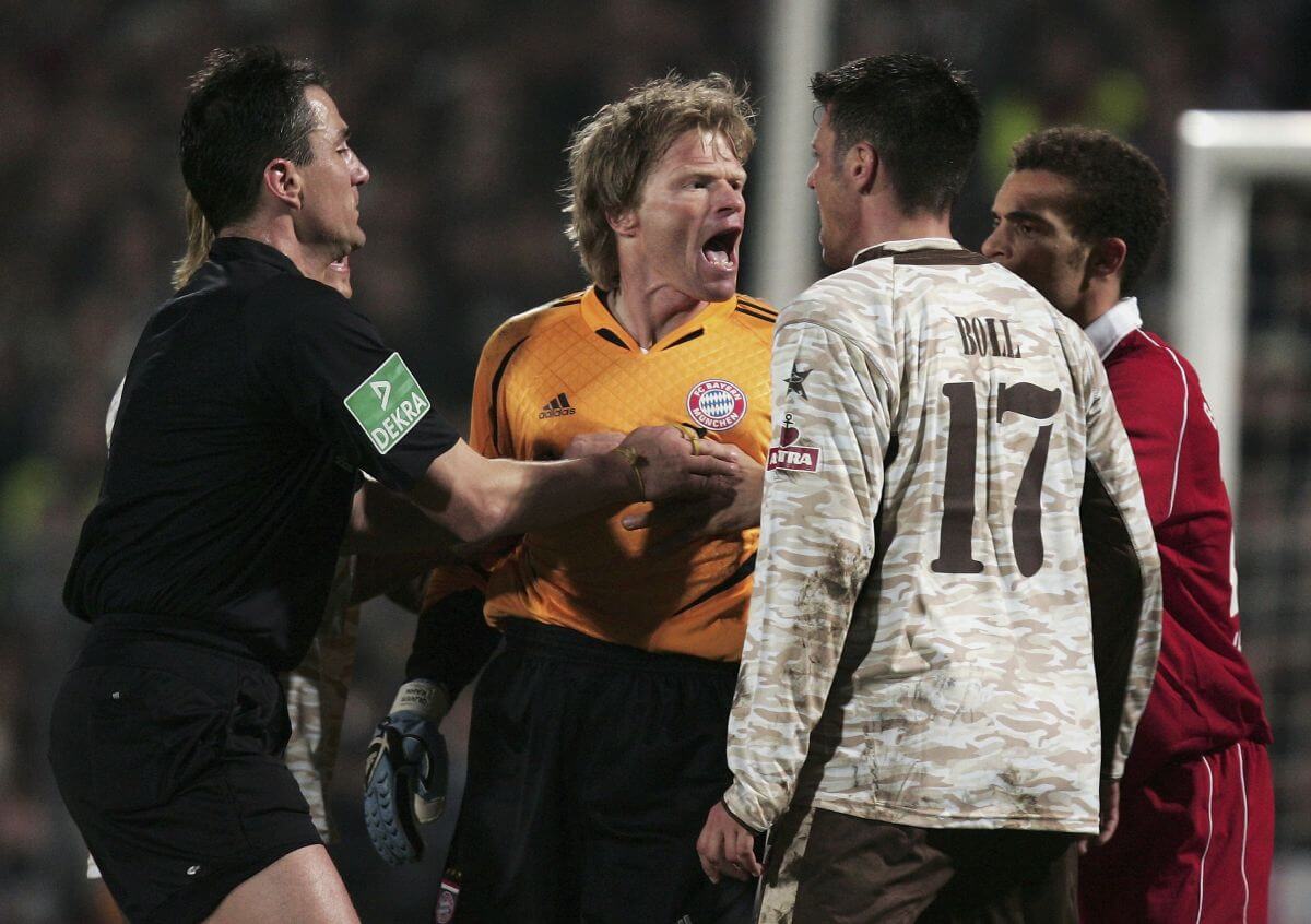 HAMBURG, GERMANY - APRIL 12: Oliver Kahn (C) goalkeeper of Munich argues with Fabian Boll (#17) of St.Pauli during the DFB German Cup Semi Final match between FC St. Pauli and Bayern Munich at the Millerntor Stadium on April 12, 2006 in Hamburg, Germany. (Photo by Martin Rose/Bongarts/Getty Images)