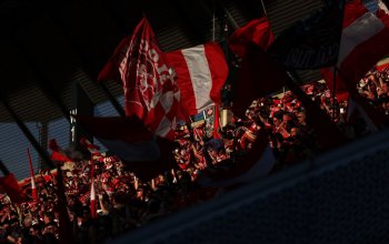 ESSEN, GERMANY - MAY 22: Fans of Rot-Weiss Essen show their support from the stands during the 2. Bundesliga Playoff Leg One match between Rot-Weiss Essen and SpVgg Greuther Fürth at Stadion an der Hafenstrasse on May 22, 2026 in Essen, Germany. (Photo by Lars Baron/Getty Images)