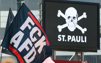 HAMBURG, GERMANY - AUGUST 09: St. Pauli fans show their support with flags during the 2. Bundesliga 2026/27 match between FC St. Pauli and SpVgg Greuther Fürth at Millerntor Stadium on August 09, 2026 in Hamburg, Germany. (Photo by Selim Sudheimer/Getty Images)